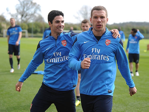 Mikel Arteta dan Lukas Podolski saat bermain untuk Arsenal