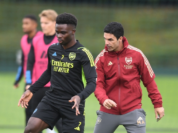 Bukayo Saka dan Mikel Arteta