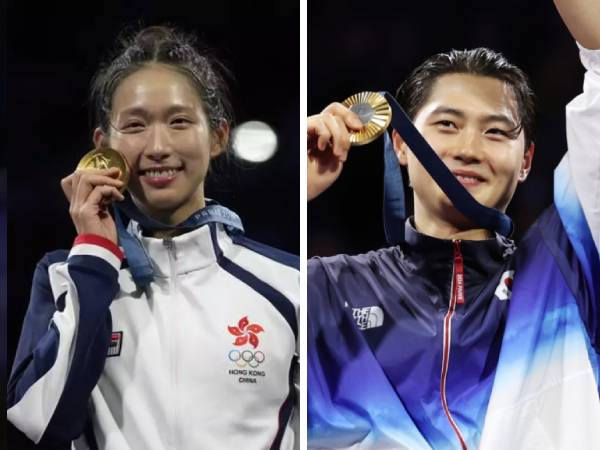 Vivian Kong Man Wai dari Hong Kong (kiri) dan Oh Sang-uk dari Korea Selatan merayakan medali emas mereka di Olimpiade 2024. (Foto: AP)